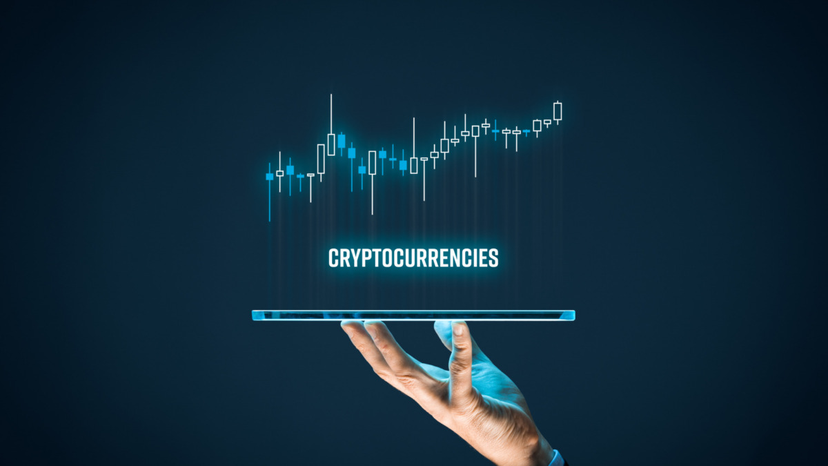 Cryptocurrencies investment concept. Investor with digital tablet and virtual tradeview graph.
